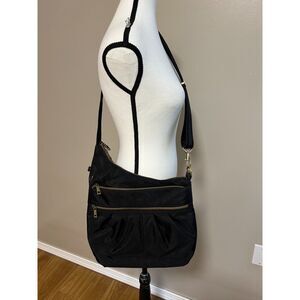 Travelon Anti-Theft Crossbody Bag in black nylon with brass-tone hardware